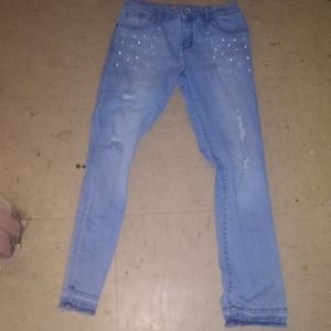 Blue ripped jeans with pearl detail